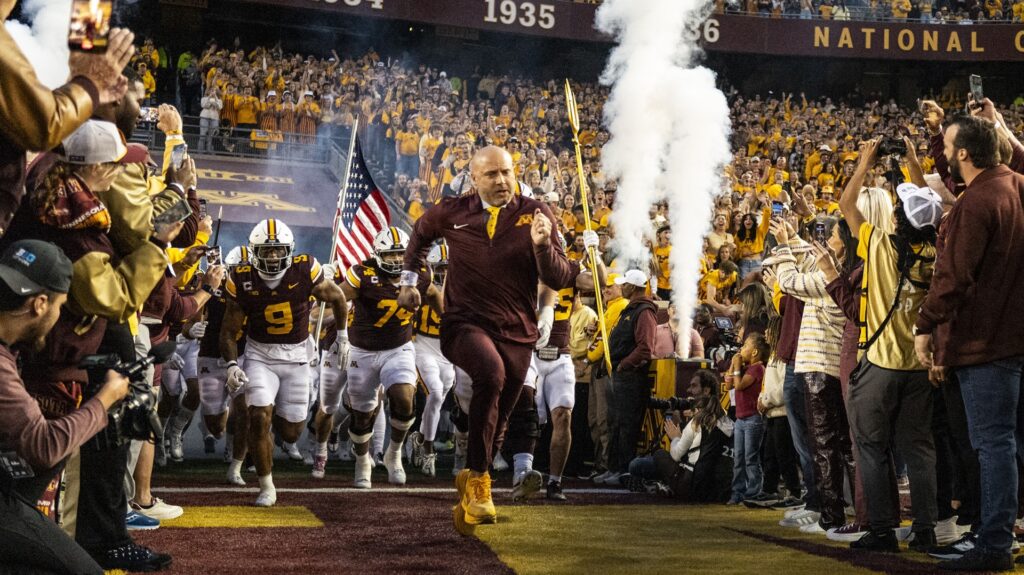 P. J. Fleck head coach of the Minnesota Golden Gophers takes the field with his team before the game against the Purdue Boilermakers at TCF Bank Stadium on October 11, 2025 in Minneapolis, Minnesota.