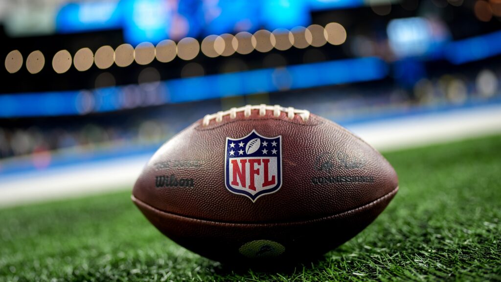 A Wilson brand The Duke football with the NFL logo is pictured on the field before the game between the Detroit Lions and Green Bay Packers at Ford Field on November 27, 2025 in Detroit, Michigan.