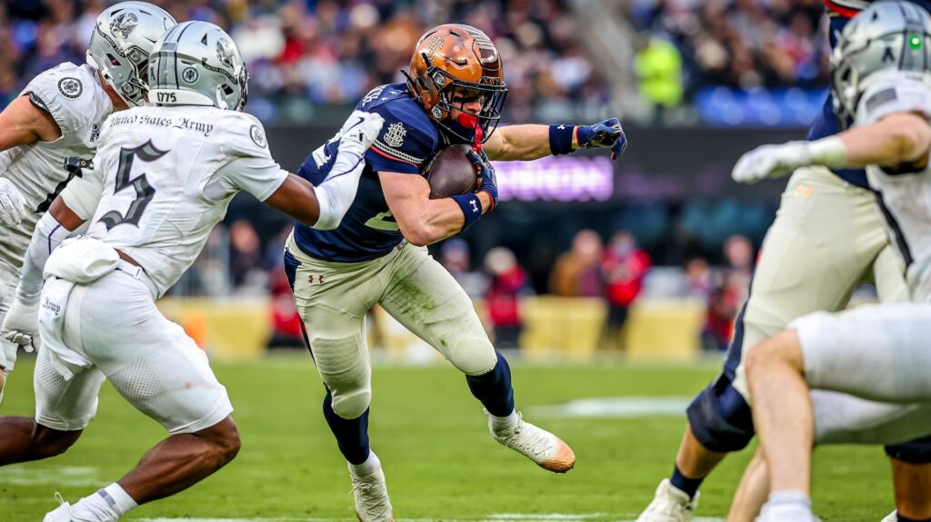 Eli Heidenreich #22 of the Navy Midshipmen runs the ball during the first half of the 126th Army-Navy Game against the Army Black Knights at M&T Bank Stadium on December 13, 2025 in Baltimore, Maryland.