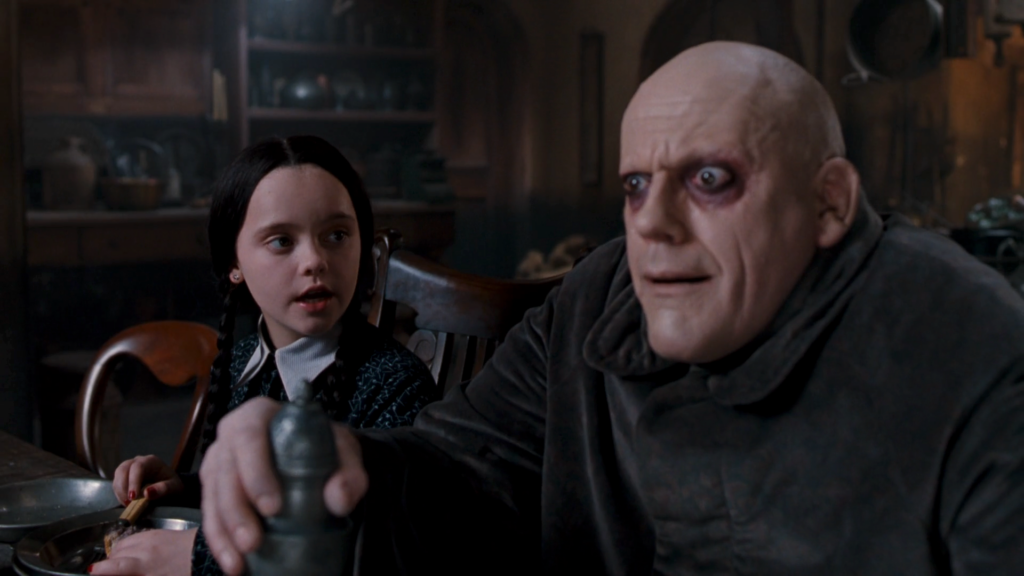 Uncle Fester (Christopher Lloyd) and Wednesday (Christina Ricci) in The Addams Family