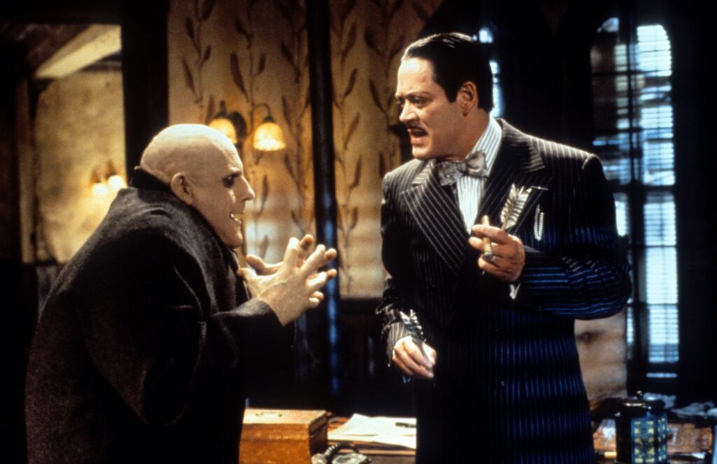 Uncle Fester (Christopher Lloyd) and Gomez (Raul Julia) in The Addams Family Values