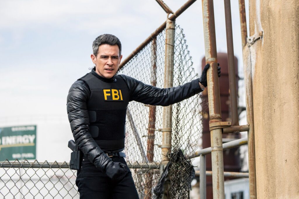 John Boyd as Stuart Scola in FBI