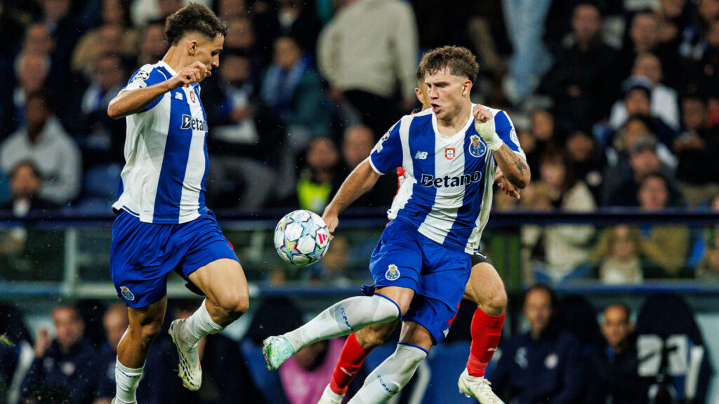 PORTO, PORTUGAL - OCTOBER 20: Oskar Pietuszewski of FC Porto in action with teammate Gabriel Veiga of FC Porto during the UEFA Champions League 2026/27 League Phase MD3 match between FC Porto and PSV Eindhoven at Estádio do Dragão on October 20, 2026 in Porto, Portugal.