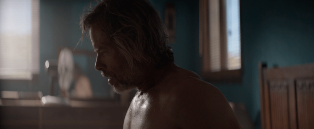 Guy Pearce as Bruce Cogburn in The Infernal Machine